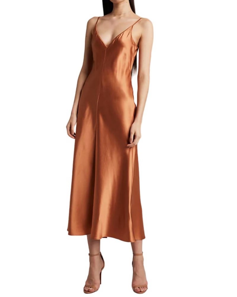Front of a model wearing a size L Long Silk Slip Dress in Terracotta in Terracotta by VOZ. | dia_product_style_image_id:363448